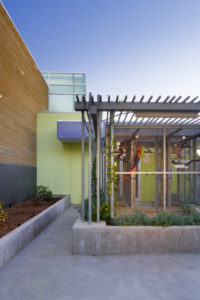 Rendering of bird cages outside the North Central Animal Services. The cage is surrounded by a concrete plant bed and covered with a metal lattice roof.