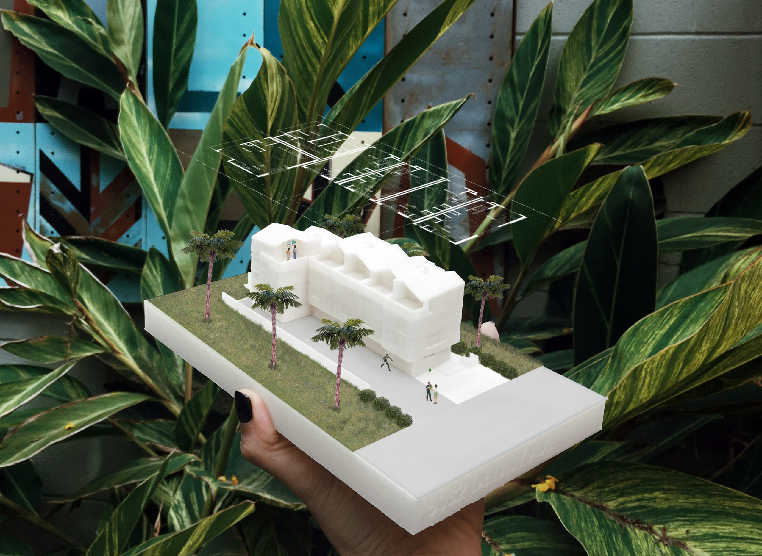 Photo of a white 3D printed model of a modern building that has rendered elements edited onto it. Vegetation, scale figures, and a floor plan of the building can be seen around the 3D printed model.