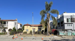 View of an existing vacant triplex and a vacant single unit from the street.